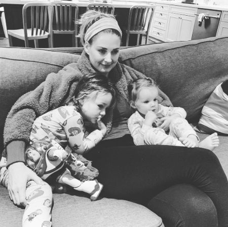 Alexandra chilling with children after her work.